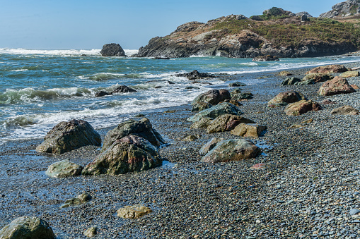 A view of large and small rocks along the shoreline in Crescent City, Callifornia.