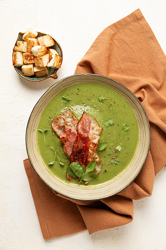 green mashed soup, with bacon and croutons, homemade, no people,