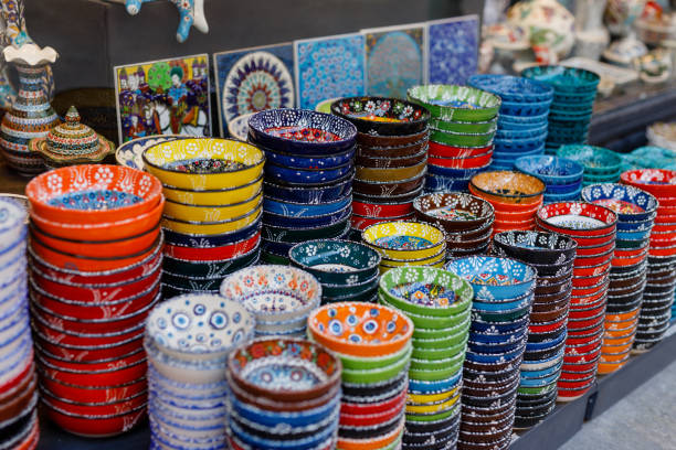 istock woman buys ceramic plates at the oriental bazaar 1733852814
