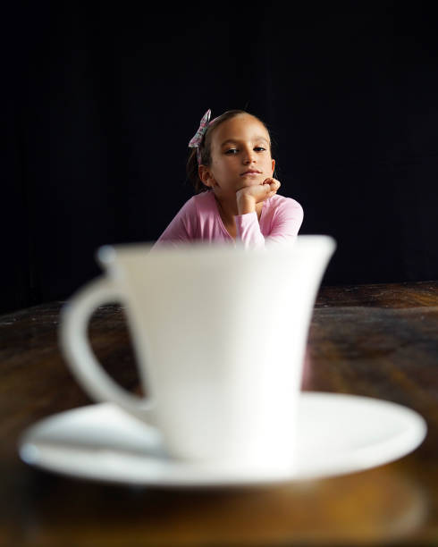 Young woman in PMS drinking a tea.