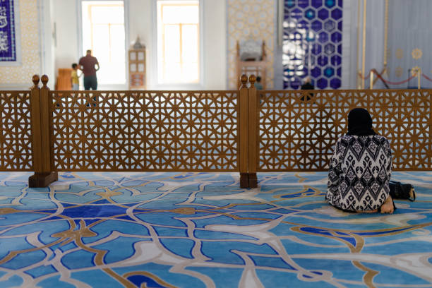 istock girl sitting inside a Turkish mosque 1733858977