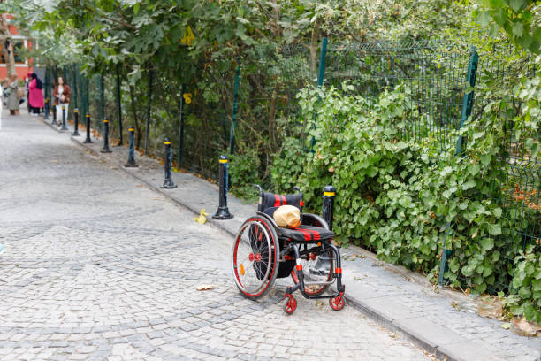 istock wheelchair standing alone on the street 1733862213