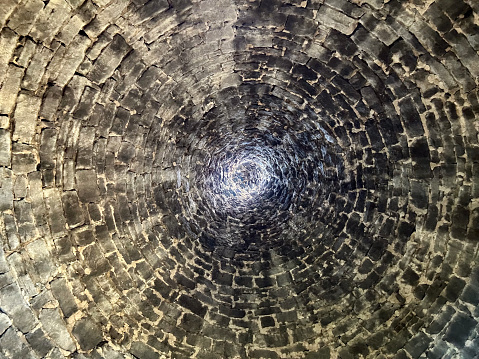 Brick tunnel vortex with receding perspective.