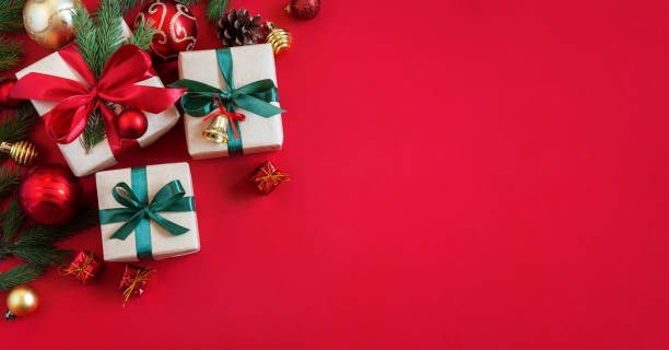 istock Holiday red background with gift boxes and Christmas decorations. Christmas holiday background. 1733890621