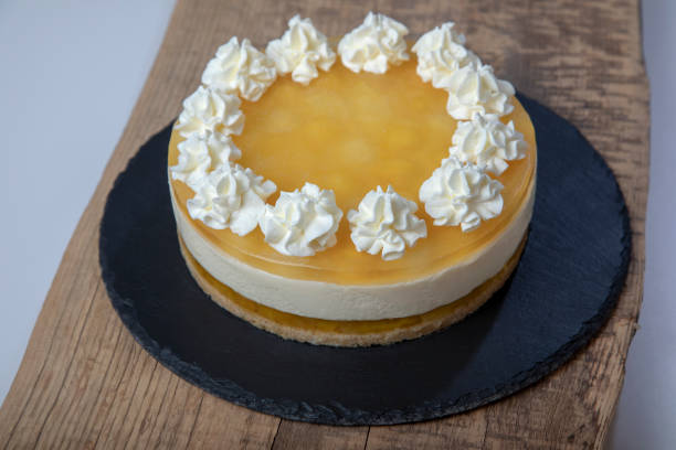 istock Homemade lemon cheesecake cake decorated with whipped cream. 1733902060
