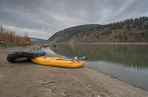 Two inflatable rafts on the shore of the Yukon River at Dawson City, Yukon, Canada