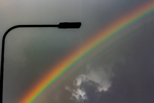 Minimalist photo of rainbow and street lamp