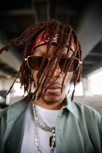 istock African American guy with dreadlocks looking at camera through sunglasses 1734008954