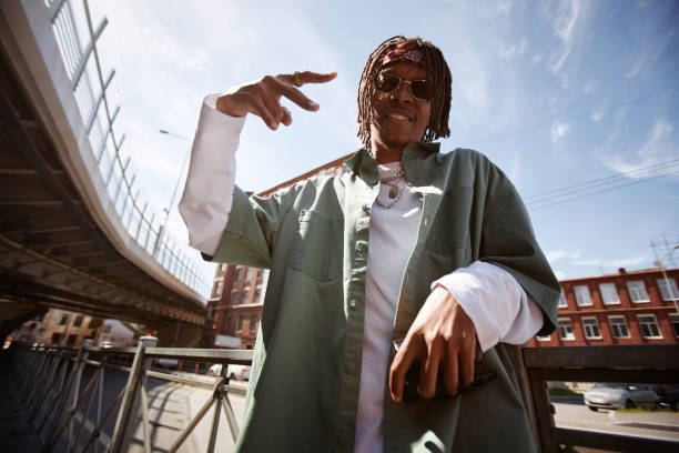 istock Happy young African American man with dreadlocks performing hip hop dance 1734009071