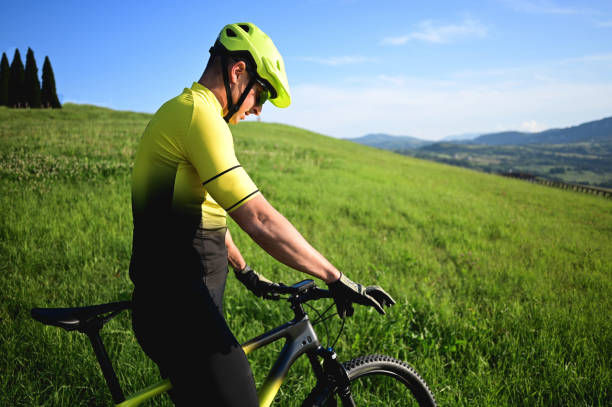istock portrait of a mountain biker in a meadow. 1734062296