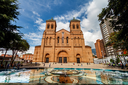 Medellin, Colombia - January 10, 2023: People walk in front of the Medellin cathedral