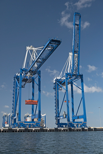 Charleston, SC, USA - October 05, 2023: Two 169-foot ship-to-shore cranes at Hugh K. Leatherman Terminal, which opened in April 2021 on the Cooper River in Charleston Harbor.