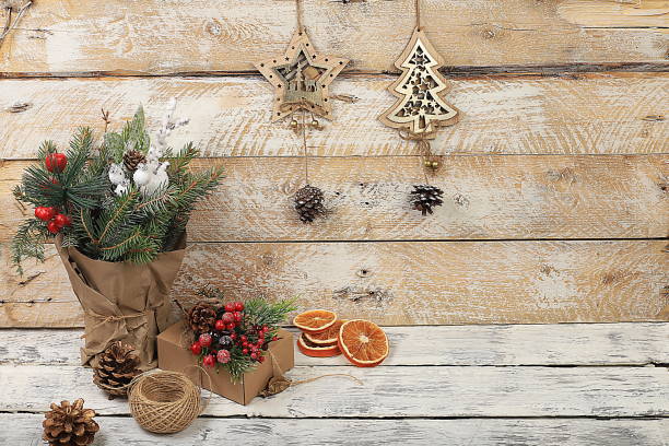 istock Empty rustic table with live Christmas tree in eco bag and homemade gift boxes and decorations.Christmas and New Year mockup for design and product demonstration, concept of zero waste, 1734145712