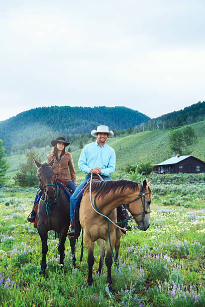 istock Couple horseback Riding Together 173419189