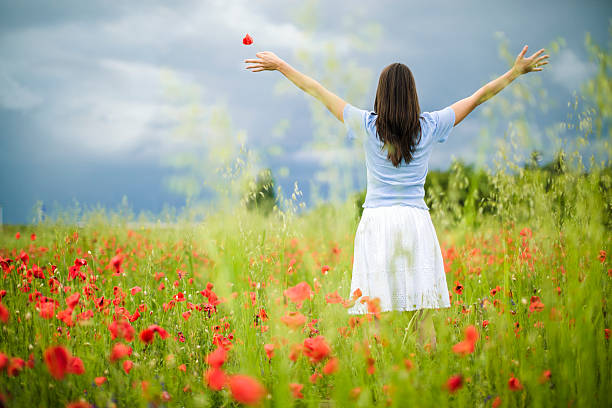istock Woman in poppy fields 173424798