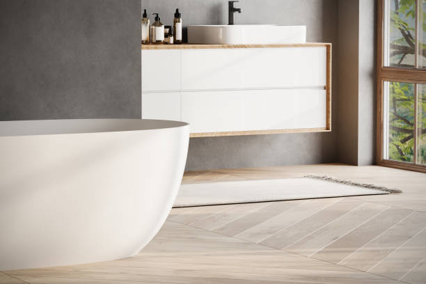istock Modern bathroom interior with dark walls, marble basin with double mirror, bathtub, parquet floor. Minimalist black bathroom with modern furniture 1734258292