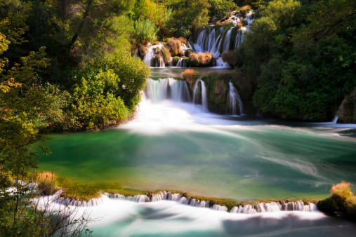 Beautiful scenic view of waterfalls coming out of the forest in Krka national park in Croatia