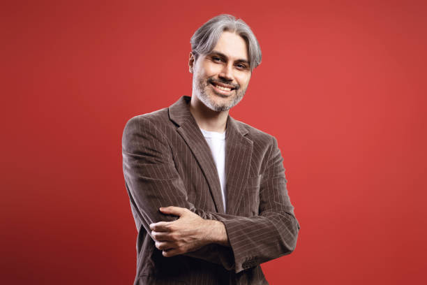istock man with arms crossed smiling 1734273863