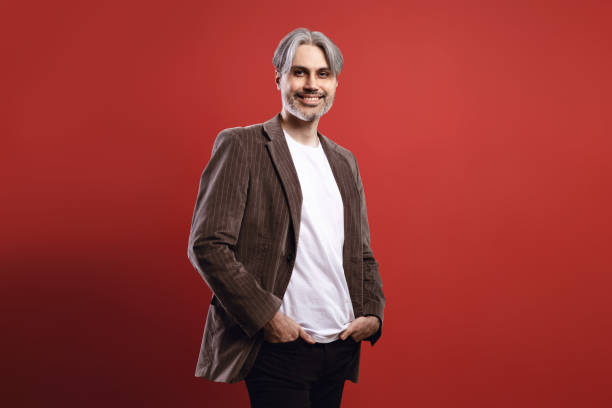 istock man smiling with hands in pocket 1734273868
