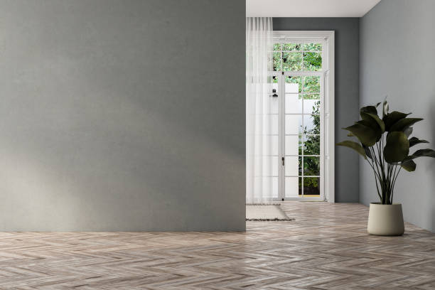 istock empty living room with gray tones walls, windows and yard. 1734285713