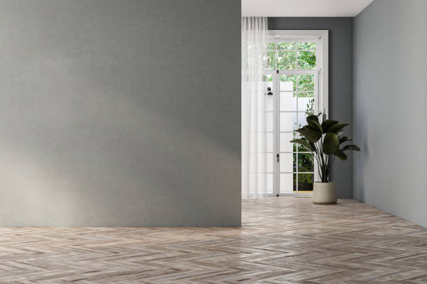istock empty living room with gray tones walls, windows and yard. 1734289342
