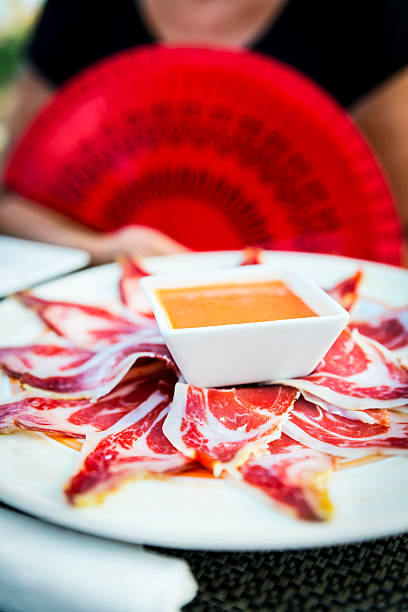 Typical spanish food: gazpacho and jamón stock photo