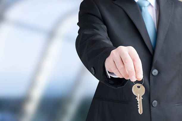 istock Man holding keys. Focus on keys 173431124