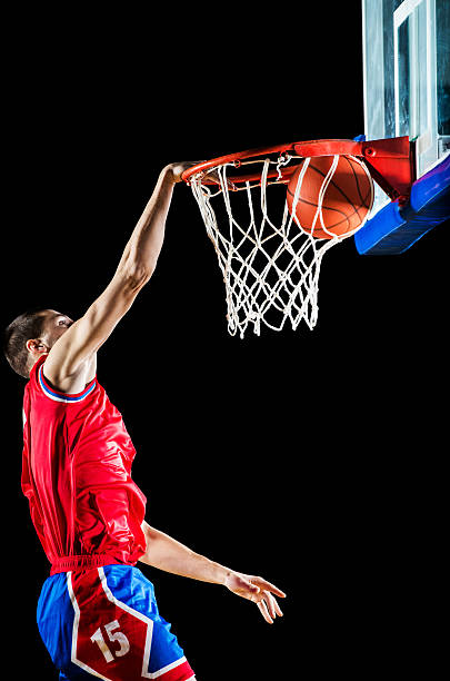 istock Basketball player slam dunking the ball. 173431286