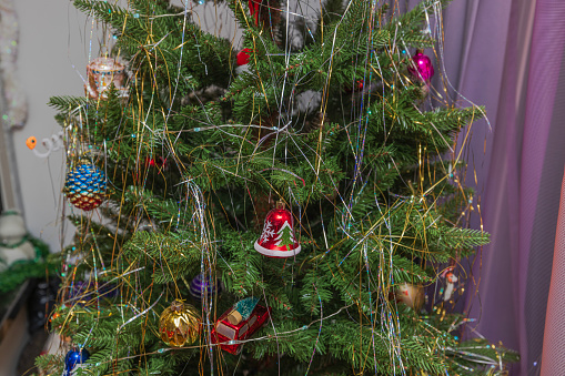 Beautiful view of decorated Christmas tree in apartment. Sweden.