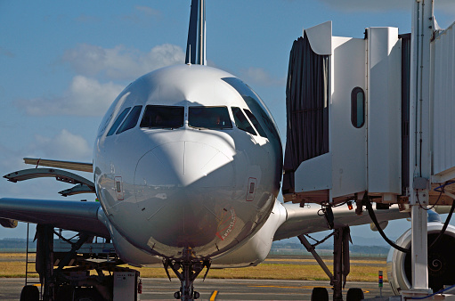 Airbus being pushed away from the gate in Copenhagen Airport at Kastrup on an overcast morning