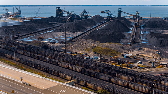 Coal heap management in Newport News, VA coal terminal. Wet mineral heaps. Minimize ignition and pollution risks, promoting environmental wellbeing