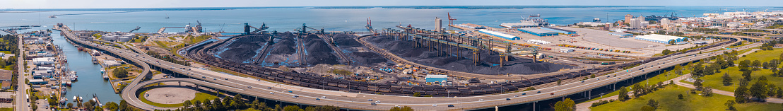 Maintenance operations in Coal Terminal port in Newport News, VA. Hampton Roads Beltway cross the terminal in marina.