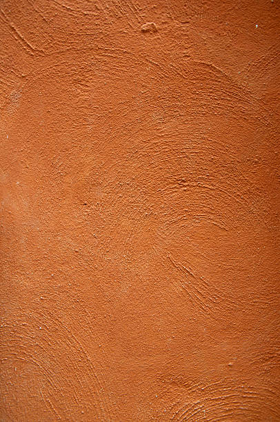 istock Cement background with a texture of orange wall 173443736