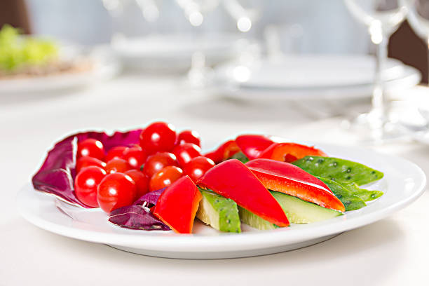 plate with sliced vegetables stock photo