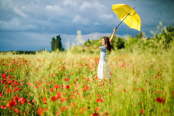 istock Woman in poppy fields 173443926