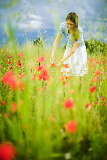istock Woman in poppy fields 173444175