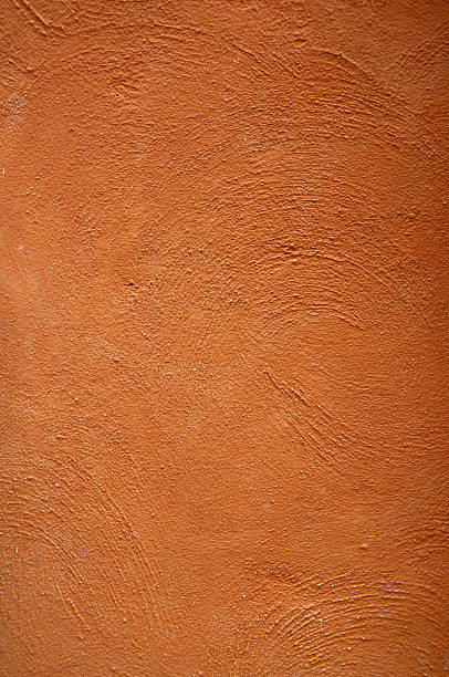 istock Cement background with a texture of orange wall 173444779