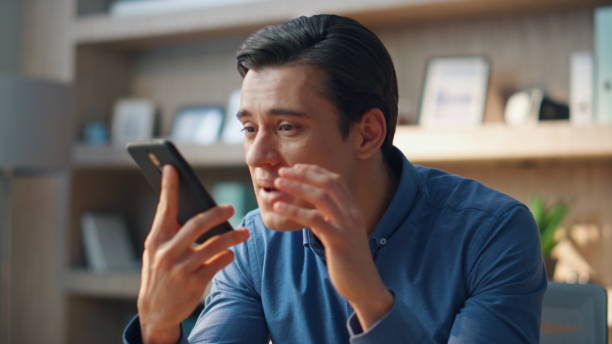 istock Closeup angry businessman arguing mobile phone call at workroom. Man ending chat 1734452389