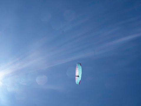 Abstract Paraglider riding the thermals