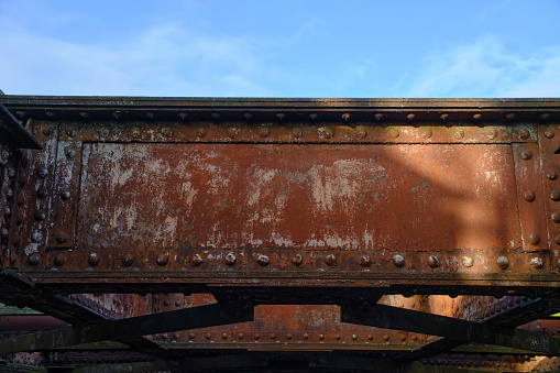 Old rusty metal structure with rivets, bridge detail