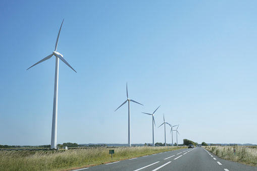 Row of wind power turbines along the N9 highway coming from Den Helder in the Netherlands.