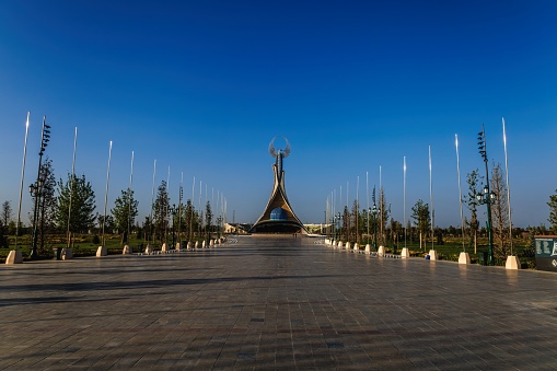 Tashkent, Uzbekistan - April 19, 2023: Memorial of Freedom and Independence in the form of a pyramid on the square of the city park New Uzbekistan (Yangi Uzbekistan) with a tower where the Humo bird