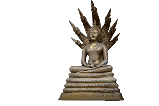 small Buddha statue.A small Buddha statue has Naga witnesses on top.