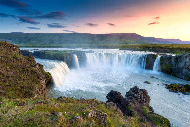 istock Sunset over Godafoss waterfall flowing in summer at Iceland 1734701060