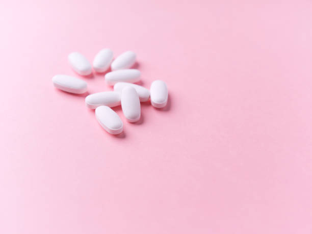 istock White tablets on bright paper background. Soft focus. Close up. Copy space. 1734708517