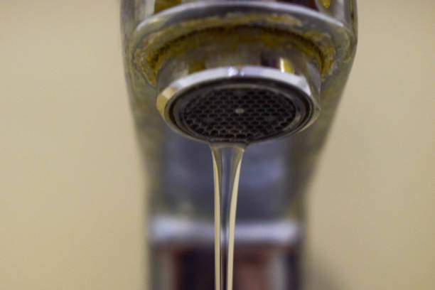 istock water flowing from rusty fountain 1734746813