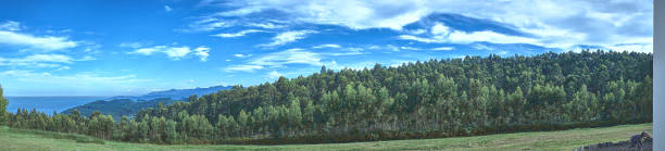 istock Panoramic mountain with very green trees, with a magnificent sky 1734783948