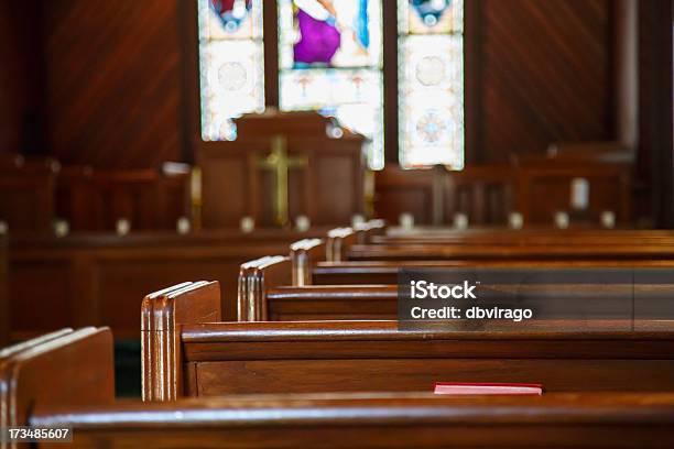 Church Pews With Stained Glass Beyond Pulpit Stock Photo - Download Image Now - Church, Pew, Empty