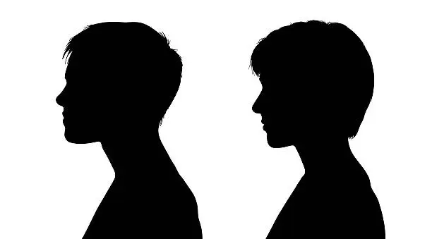 Photo of two profiles of young white women with short hair