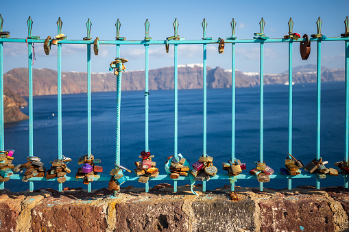 Love locks attached to a pedestrian footbridge in Oia, Santorini,